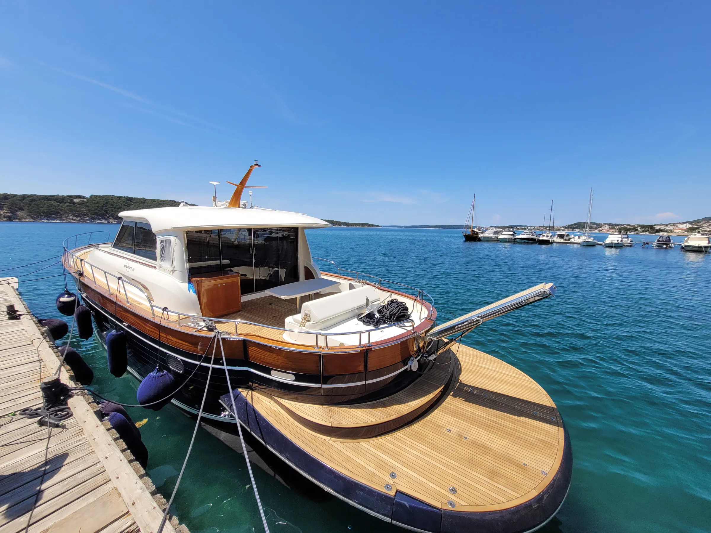 Apreamare 64 teak deck: cockpit and swim platform, moored