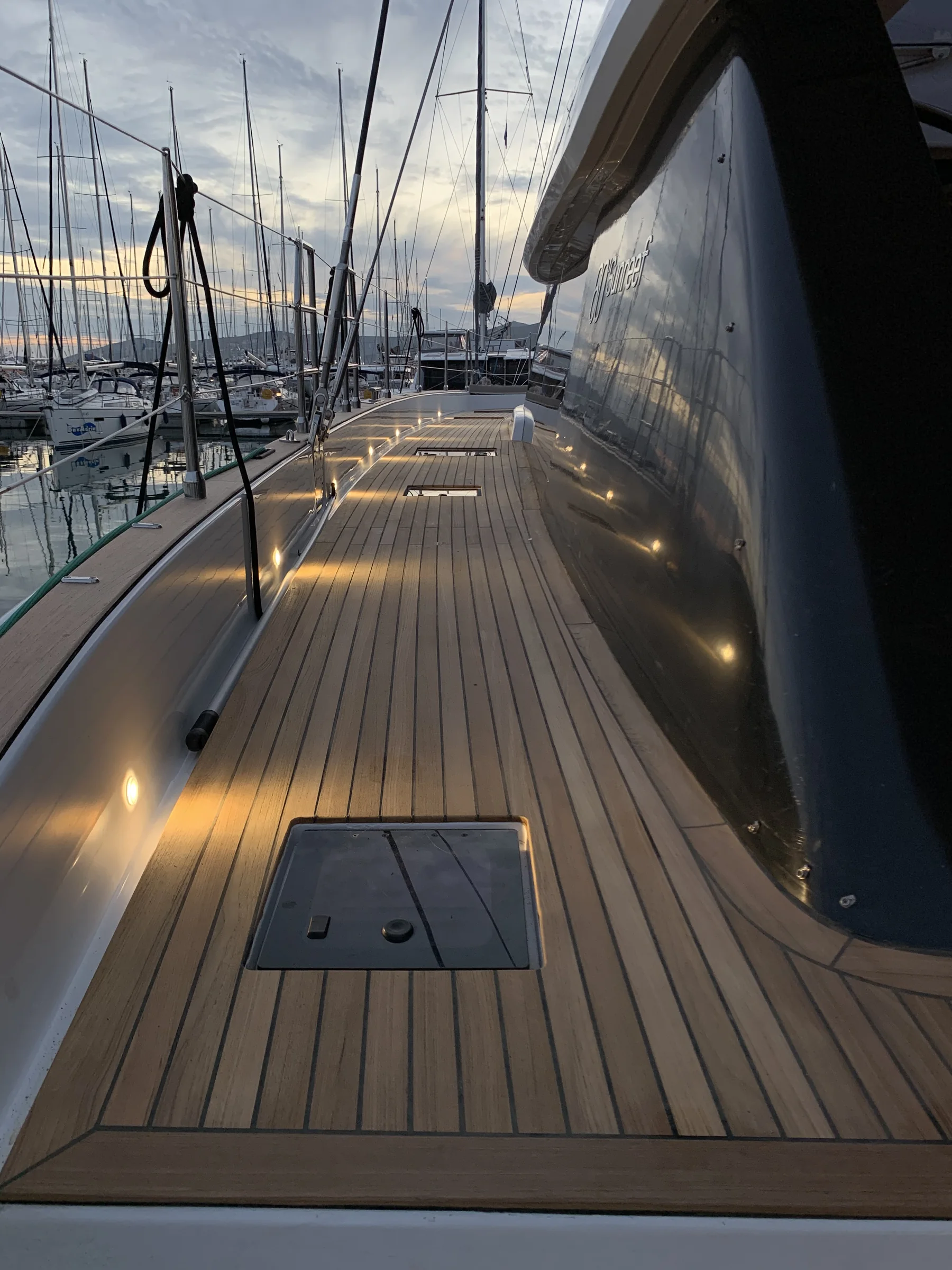 Sunreef 60 teak deck: side deck, deck lights on
