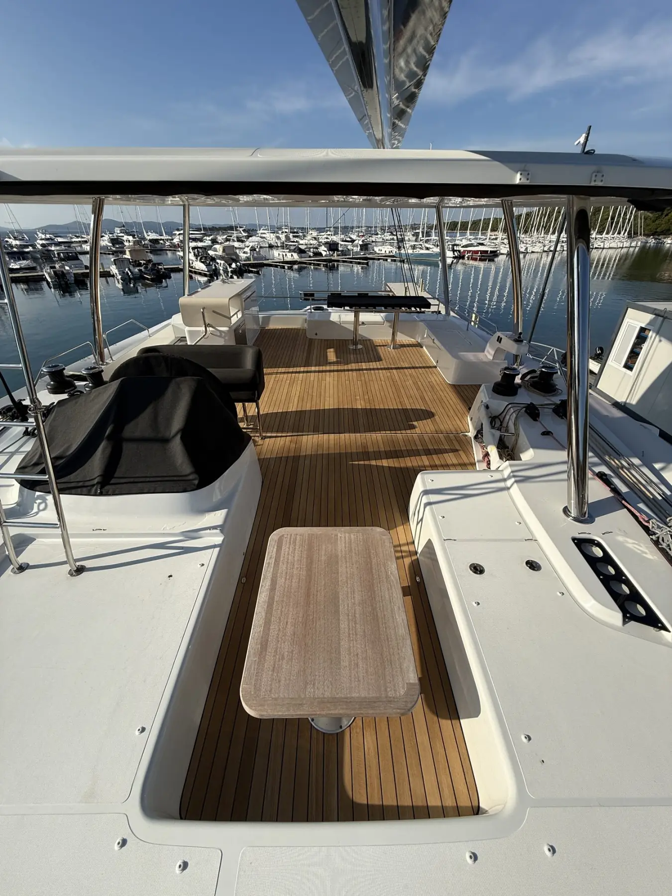 Teak cockpit table on a teak sole