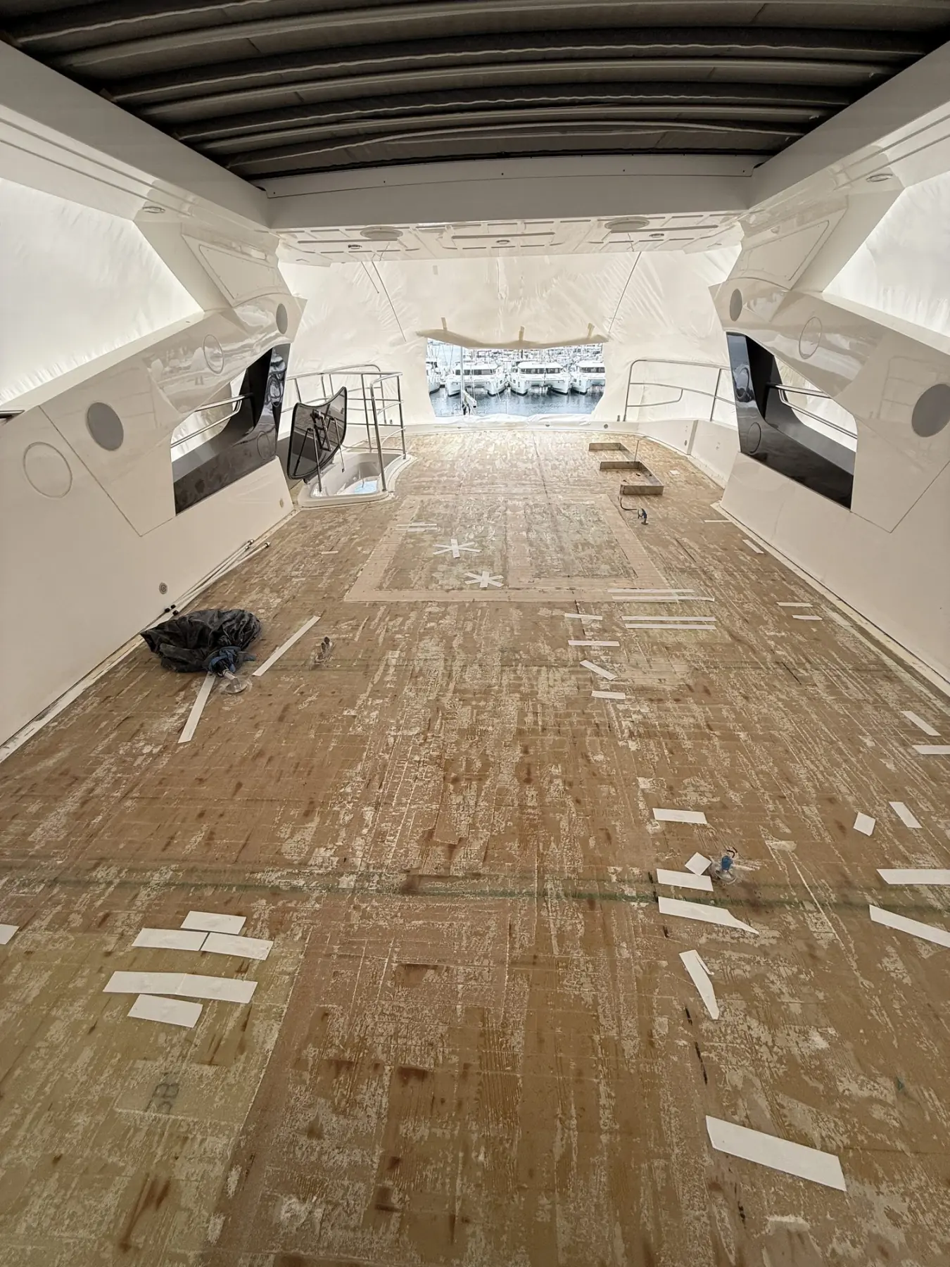 Old deck removed, adhesive residue still on the substrate