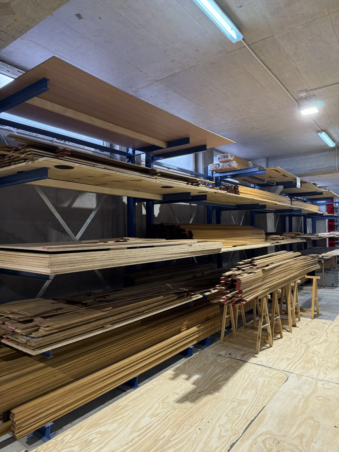 Timber racks in the workshop holding plank and sheet stock