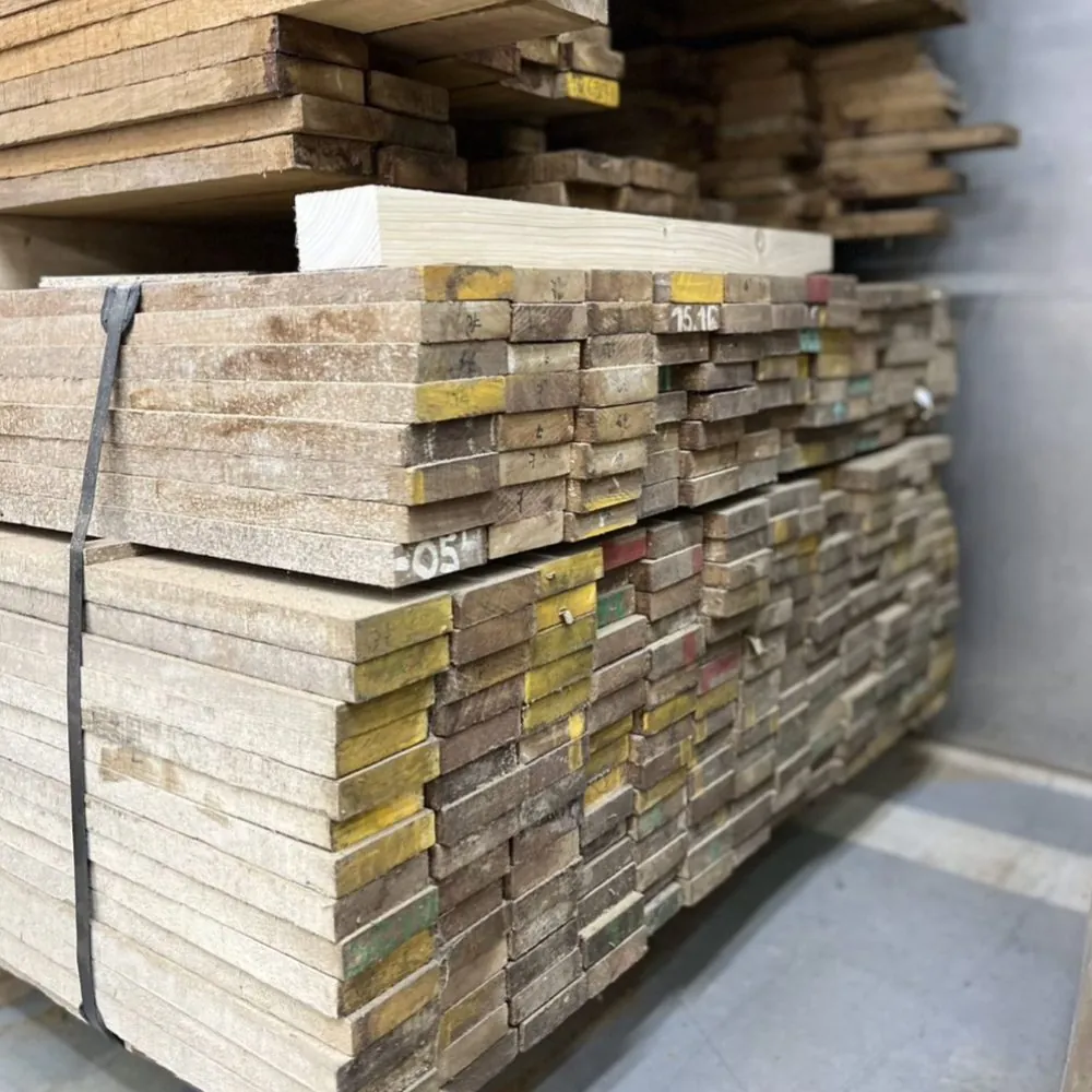 Ends of teak planks in stock