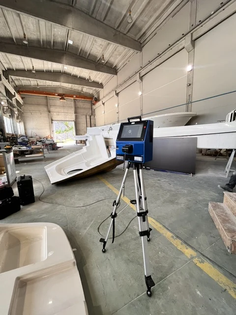 Digital templating scanner on a tripod in the workshop hall